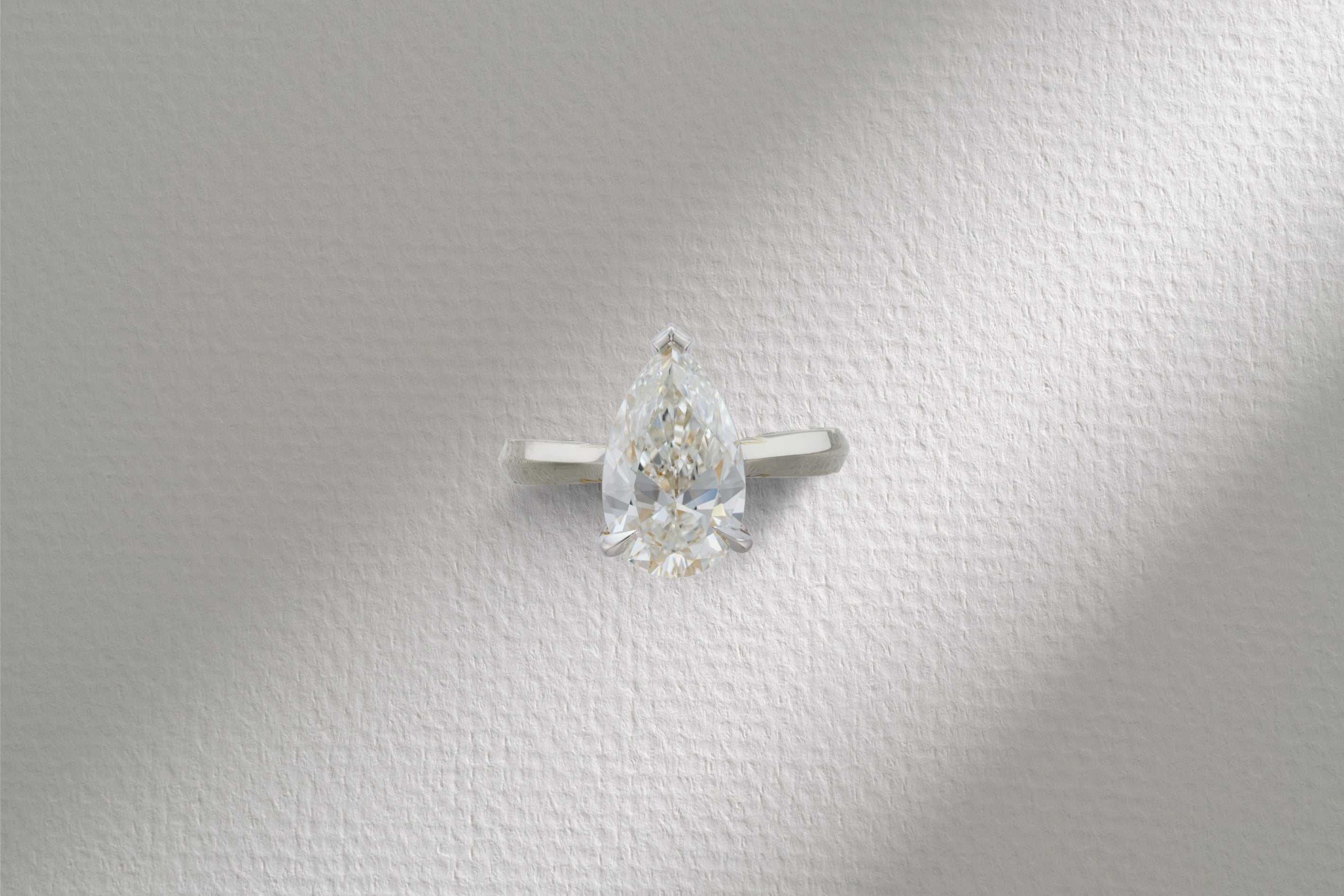 One-of-a-Kind Pear Diamond Ring with Gold Detailing