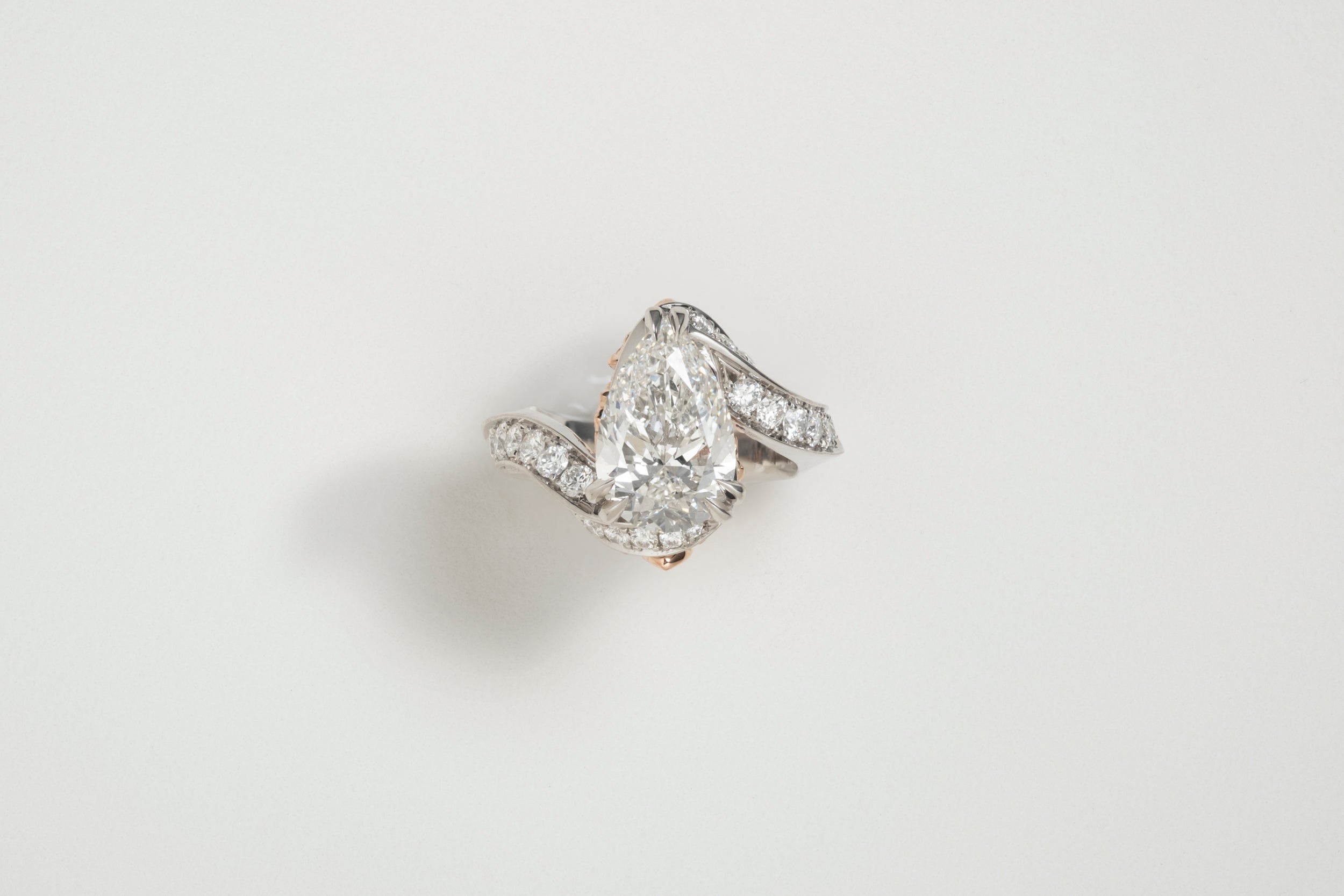 One-of-a-kind Diamond Pear Ring with butterfly finger rest