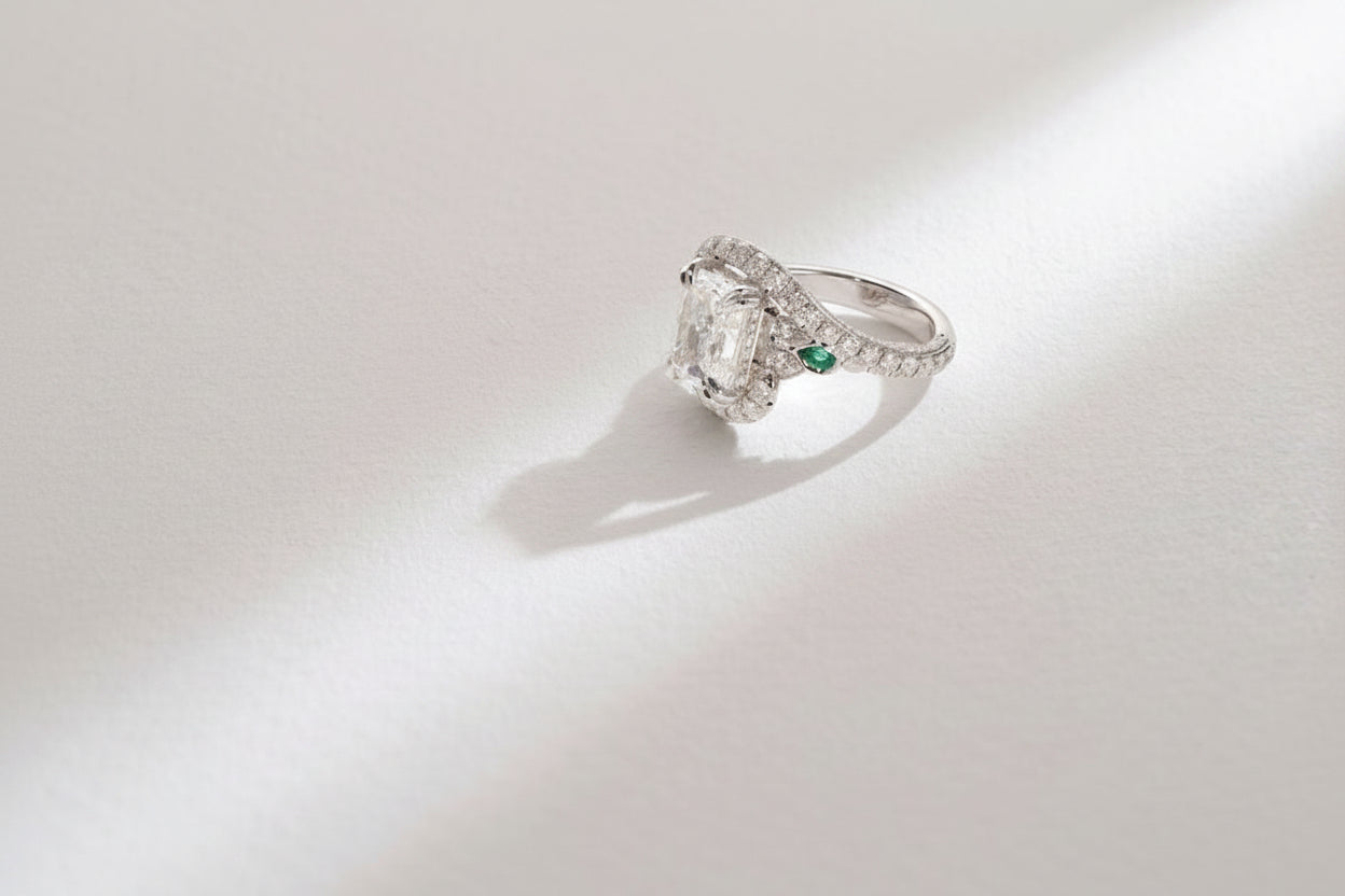One-of-a-Kind Radiant Diamond Ring with Emerald Sidestones