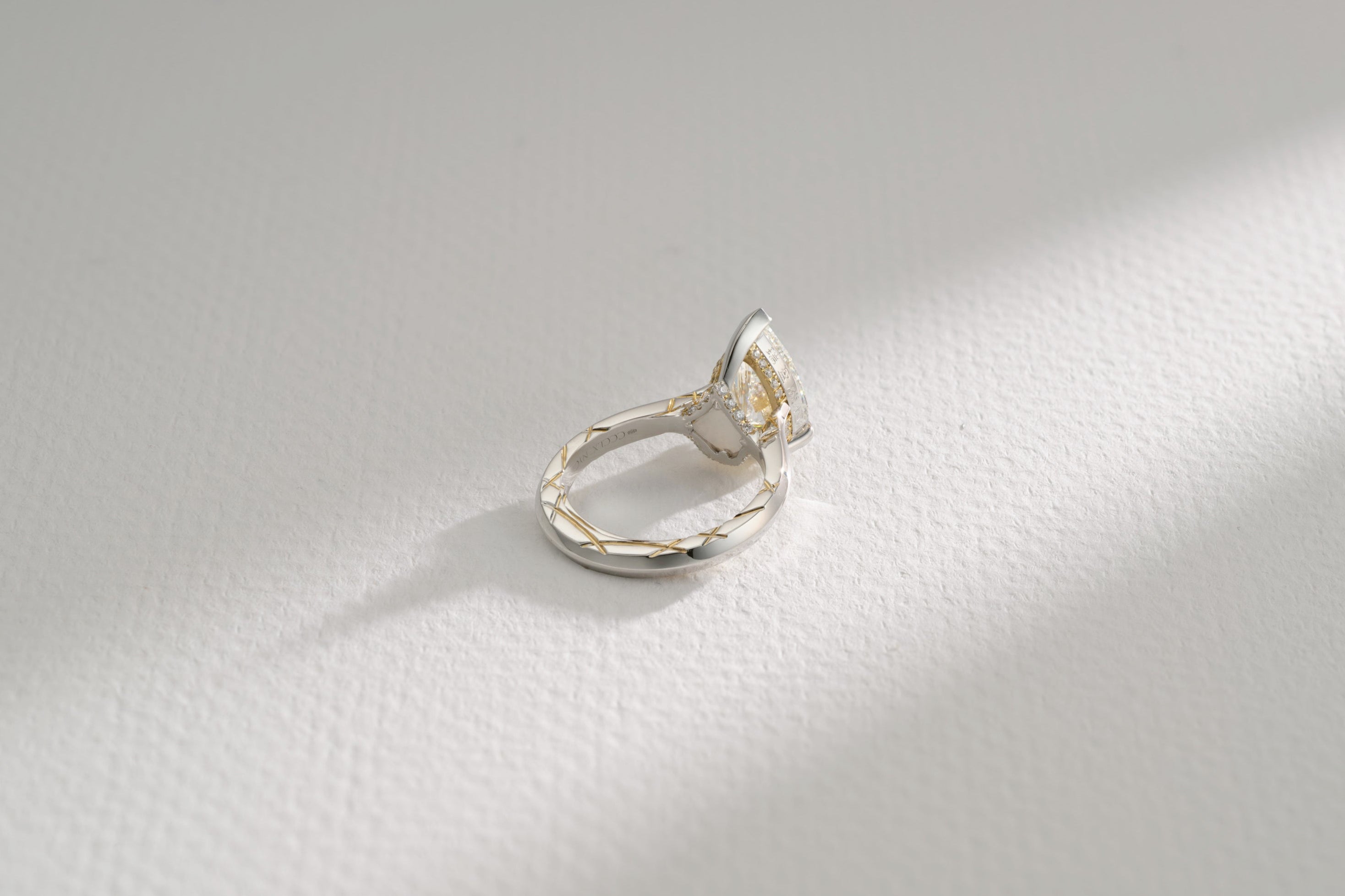 One-of-a-Kind Pear Diamond Ring with Gold Detailing